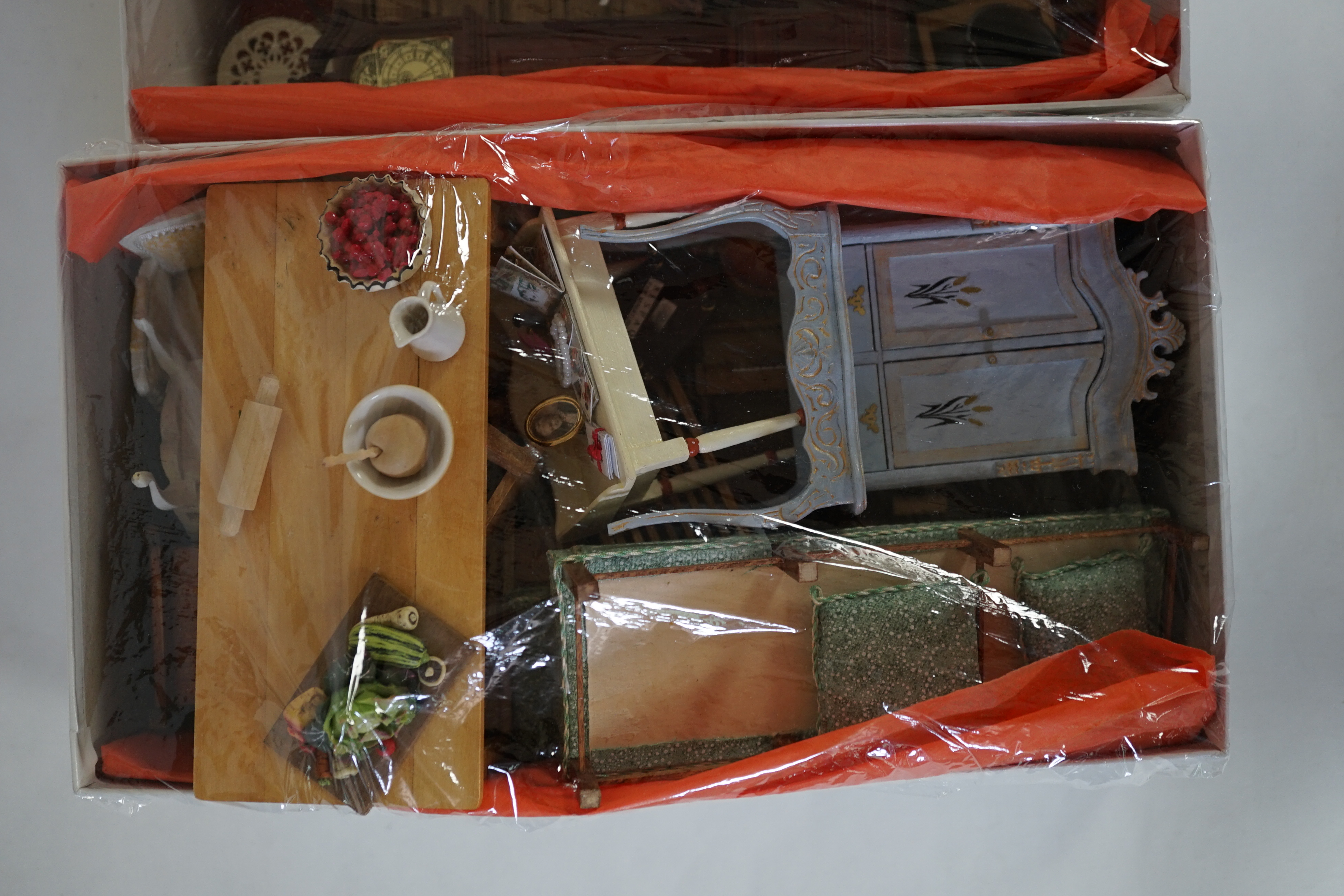 A large modern Georgian style dolls house and extensive contents, with eight fully decorated rooms on four floors, and fitted with electric lighting, removable front steps and pavement section to access basement rooms, 1